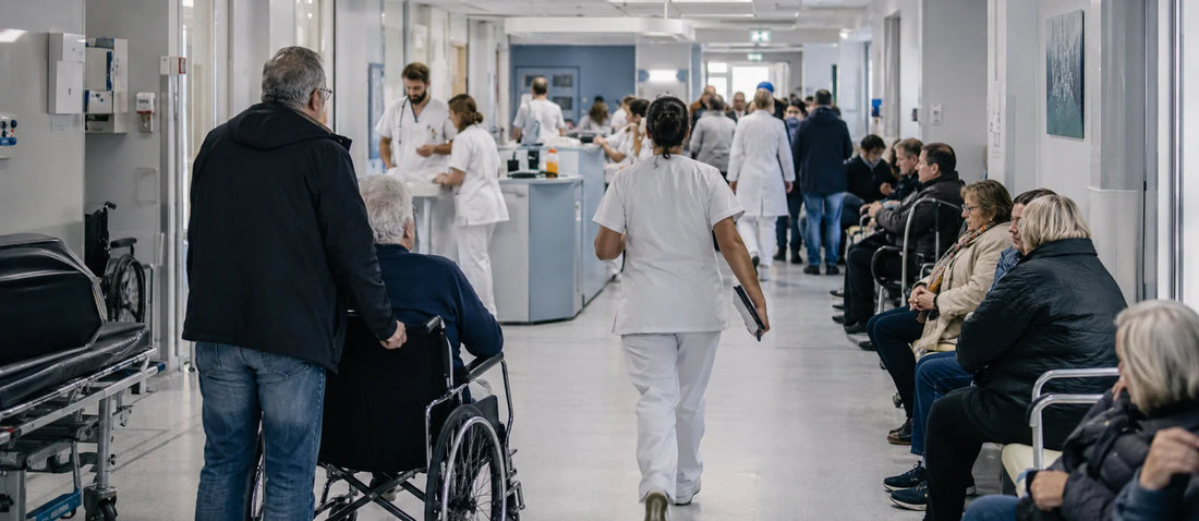 Busy French public hospital corridor with patients, family members, wheelchairs, and moving medical staff, illustrating healthcare system pressure and overcrowding.